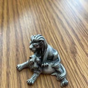 Pewter lion and lioness.